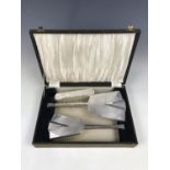 A cased Art Deco style electroplate hand mirror and brush set