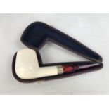 A cased meerschaum pipe