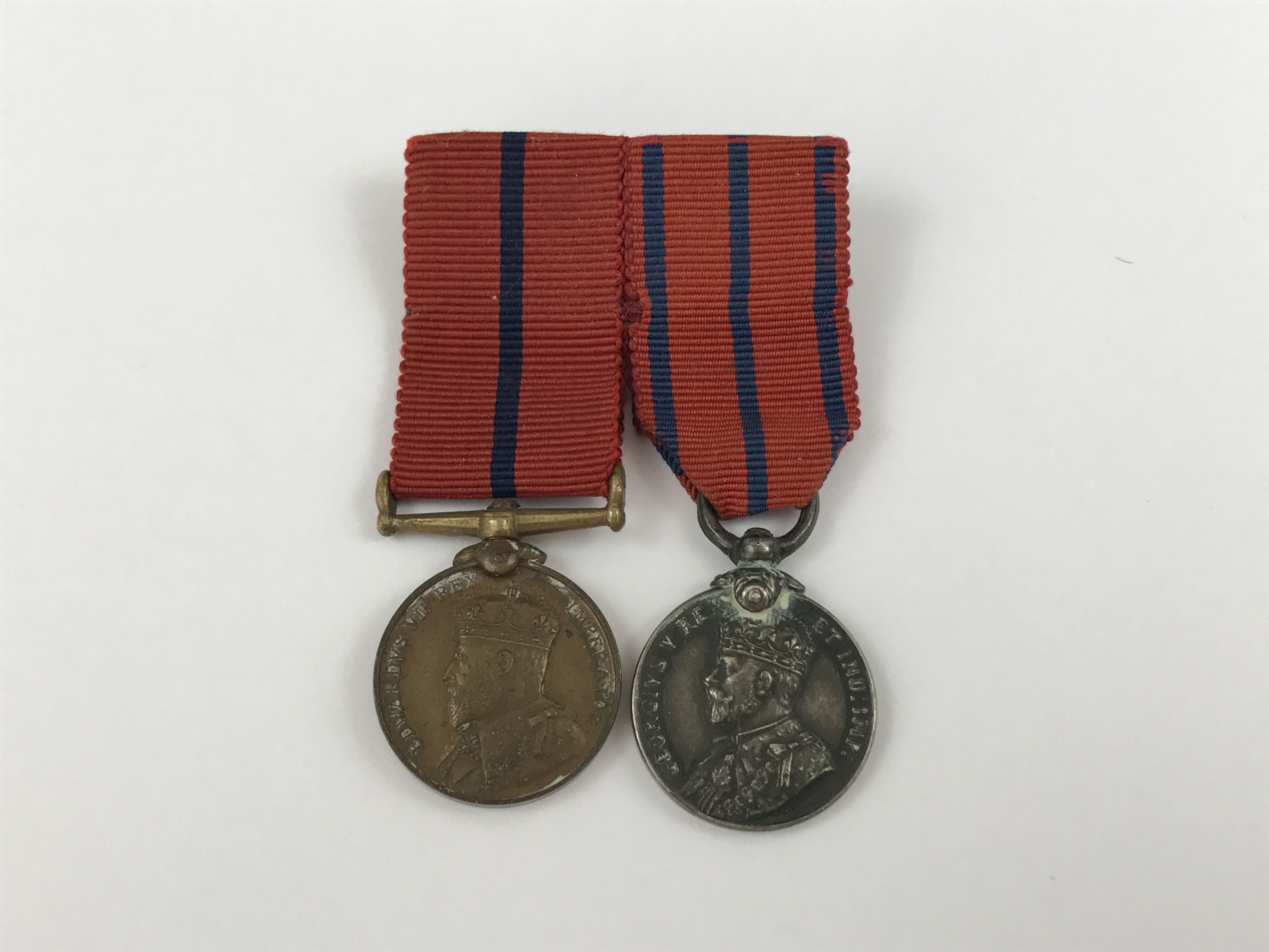 A mounted pair of Metropolitan Police royal commemorative medal miniatures commemorating the