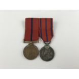 A mounted pair of Metropolitan Police royal commemorative medal miniatures commemorating the