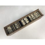 A set of Victorian bone and ebony double-sided dominoes