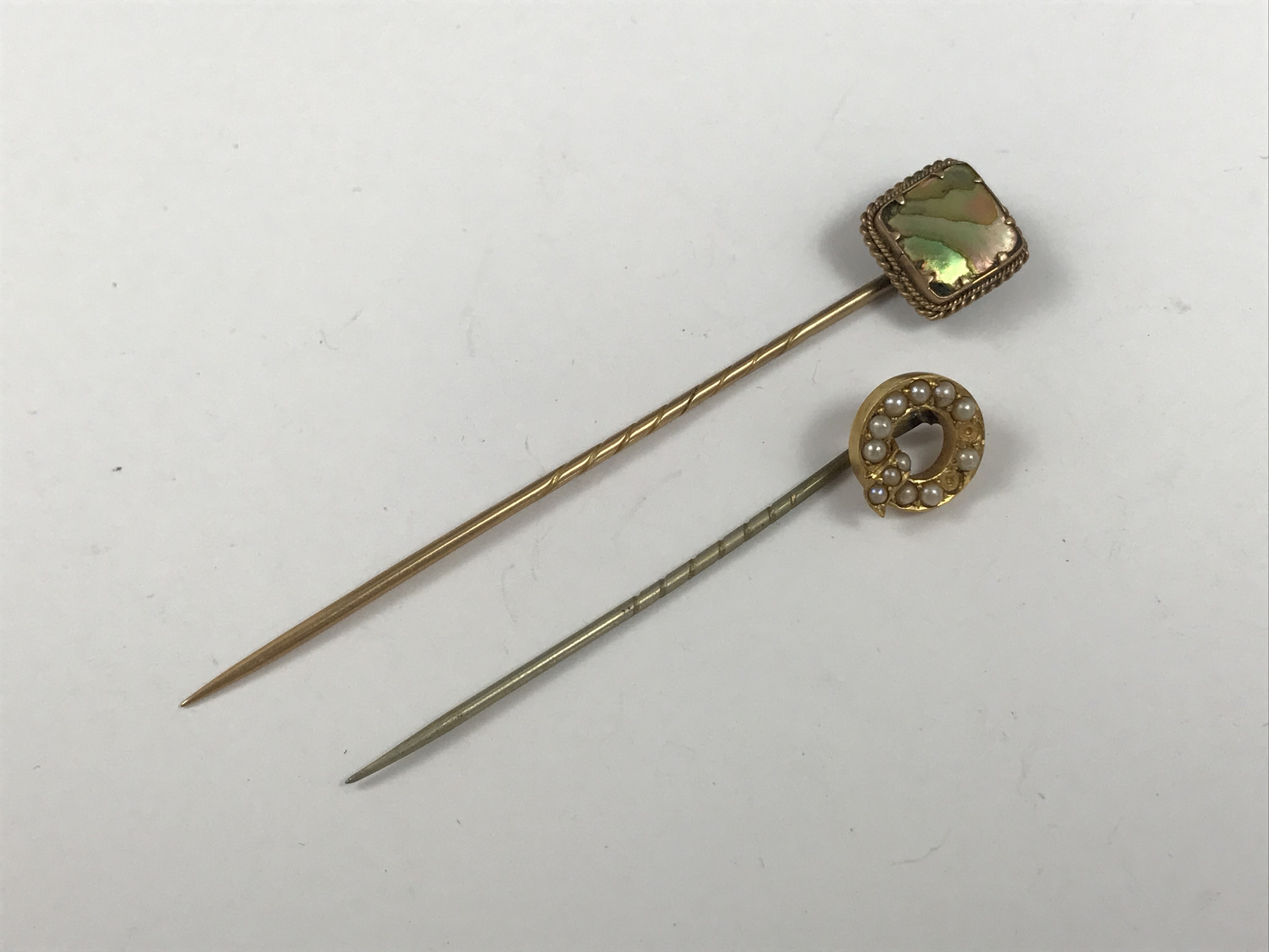 Two Victorian yellow-metal stick pins