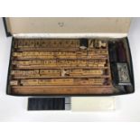 A vintage printing set together with a set of dominoes