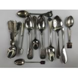 Eight silver spoons together with a silver butter knife and a cocktail fork etc