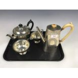 A Sheffield electroplate three-piece tea set together with an electroplate water jug with ivory