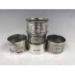 Five Victorian and later silver napkin rings
