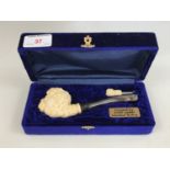 A cased meerschaum pipe by Eyup Sabbi of Turkey, the bowl modelled as Bacchus