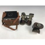 A Kodak Six-20 Brownie Junior camera, together with a set of Victorian field glasses and a vintage