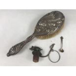 An Art Nouveau silver hair brush together with a bottle stopper and a Connemara marble / silver salt