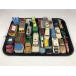 A quantity of vintage Matchbox and Dinky Toys including a Bedford Tractor Unit with a low loader, an