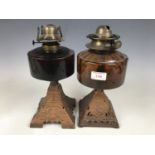 Two cast-metal and glass oil lamp bases