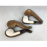 Two cased meerschaum pipes
