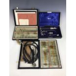 A cased vintage ophthalmic set together with a stethoscope etc