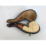 A cased carved meerschaum pipe