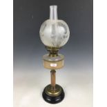 A brass and glass columnar oil lamp with florally etched shade, 63 cm