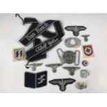 A quantity of reproduction German Third Reich insignia