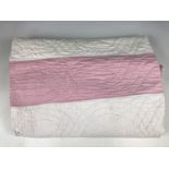 A late 19th / early 20th Century rose pink and white quilt