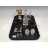 A mercury glass goblet together with a pair of knife rests and condiment jars etc