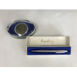 A vintage Eversharp propelling pencil and box, together with a Boys' Brigade coin paperweight