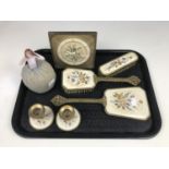 A vintage lacquered brass and petite-point dressing table set together with a pin lady