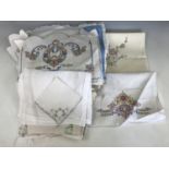 A quantity of vintage embroidered and crocheted table linens