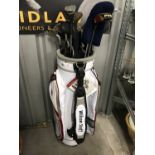 A Wilson Staff golf bag with various clubs