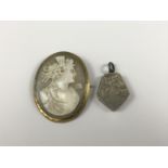 A Victorian carved shell cameo depicting the profile of a Grecian goddess, in a rolled-gold mount,