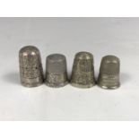 A Charles Horner silver thimble together with two nickel thimbles and one further white metal