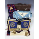 A satchel and travel case containing Cumberland and Westmorland Masonic regalia