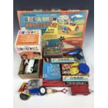 Vintage toys and games including a boxed clockwork "Coffin Bank" and a Chad Valley "Give a Show"