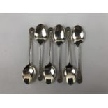 A set of six silver coffee spoons with shield-shaped terminals
