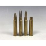 Four various inert British military .303 cartridges / cases