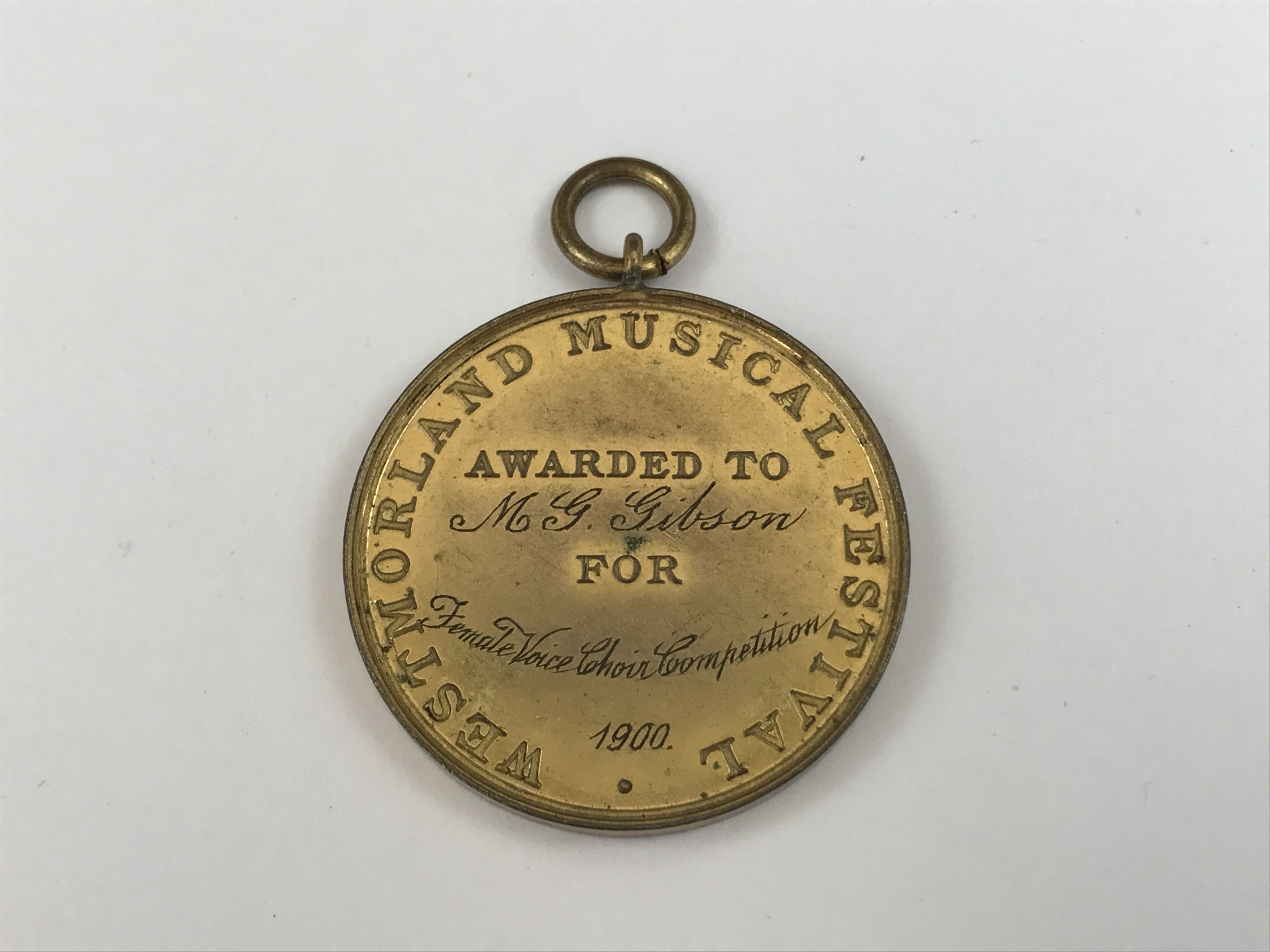 A Victorian Westmorland Music Festival "Female Voice Choir" competition prize medallion awarded to M