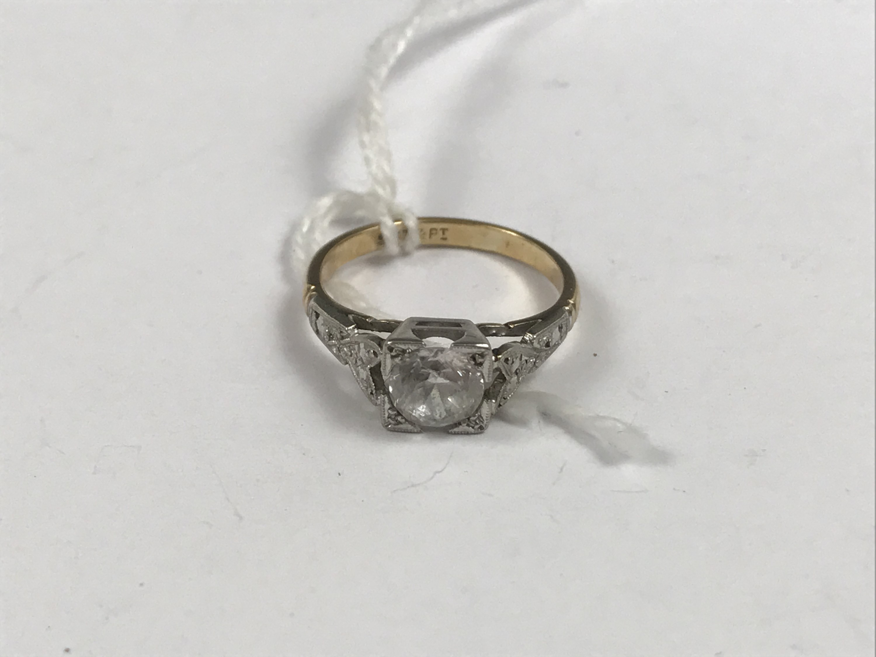 A 9ct platinum and paste solitaire ring