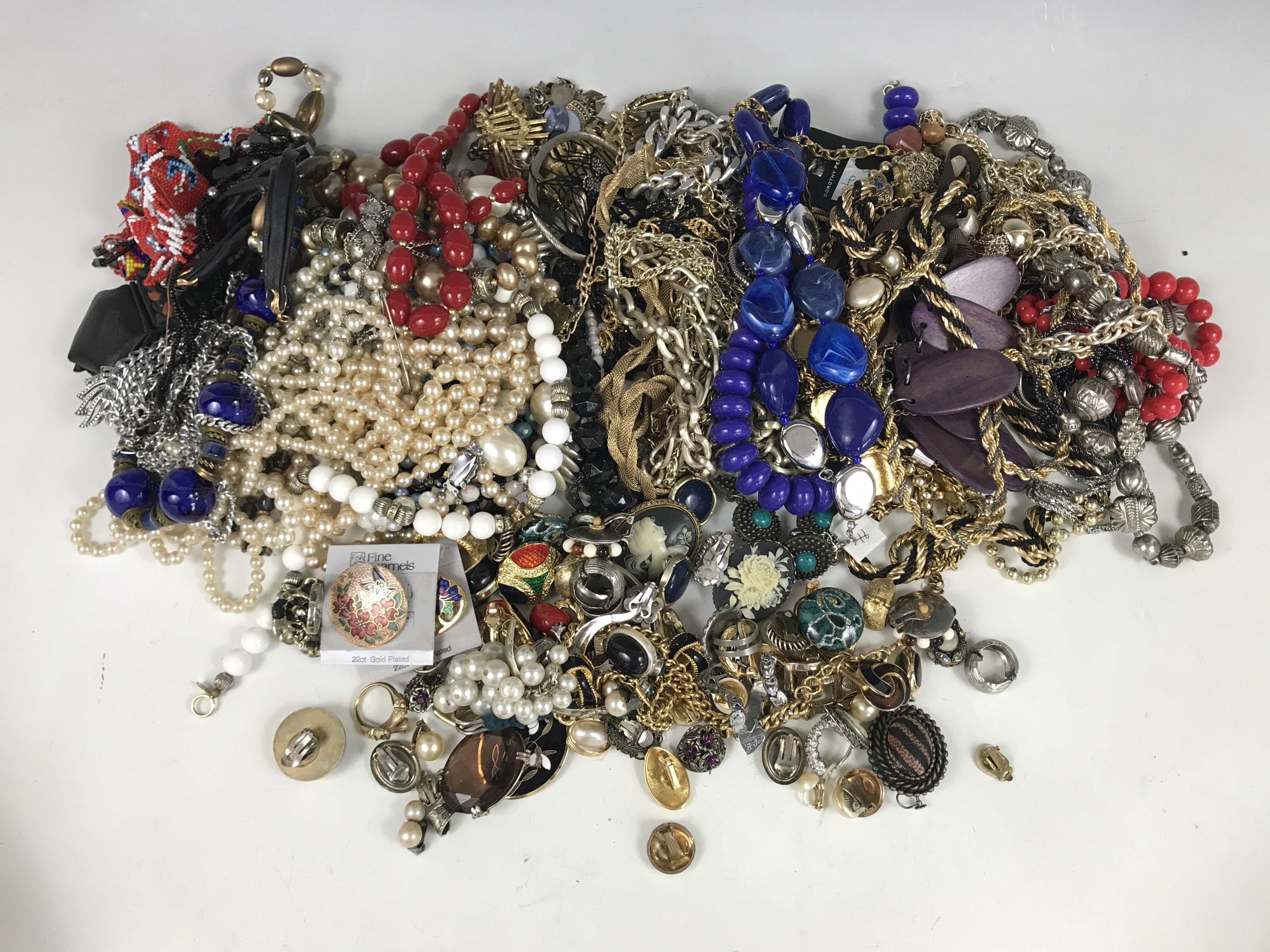 A large quantity of costume jewellery necklaces and clip-on earrings