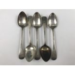 Five Georgian silver Old English pattern tea spoons, having engraved terminals