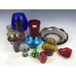 A large quantity of coloured studio glass ware