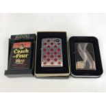Three cased Zippo lighters, including the Coach and Four from the Tobacco Tin Series, and No.
