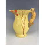 A Burgess and Leigh Burleigh Ware jug, the handle modelled as a squirrel, 18 cm [This lot is by