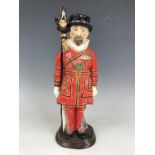 A Burgess & Leigh prototype figural decanter modelled as a Yeoman of the Guard, 31 cm [This lot is