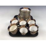 A late Victorian Melba bone china tea set, comprising 11 cups, 12 saucers, 12 side plates and two