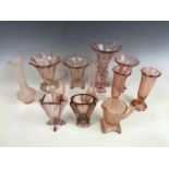 Five early 20th Century everted pink glass vases
