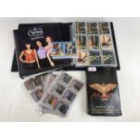 Sundry trading card packs and albums including The Crow, Charmed and Dracula together with a