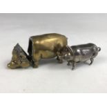 A white-metal piglet vesta case, together with a similar brass pig vesta (a/f)