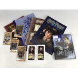 A quantity of Harry Potter collectors' / trading cards together with a postcard album