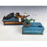 Two reproduction cast-iron mechanical money boxes / savings banks, to include "Jonah and the