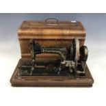 A late 19th Century Frister and Rossmann sewing machine in a marquetry inlaid walnut case
