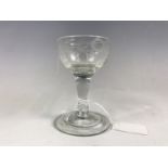 A Georgian wine glass with folded foot