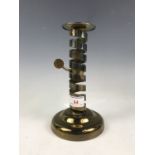 A reproduction brass spiral ejection candlestick