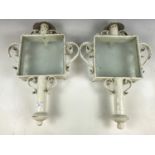 Two wrought-iron and glass exterior light sconces